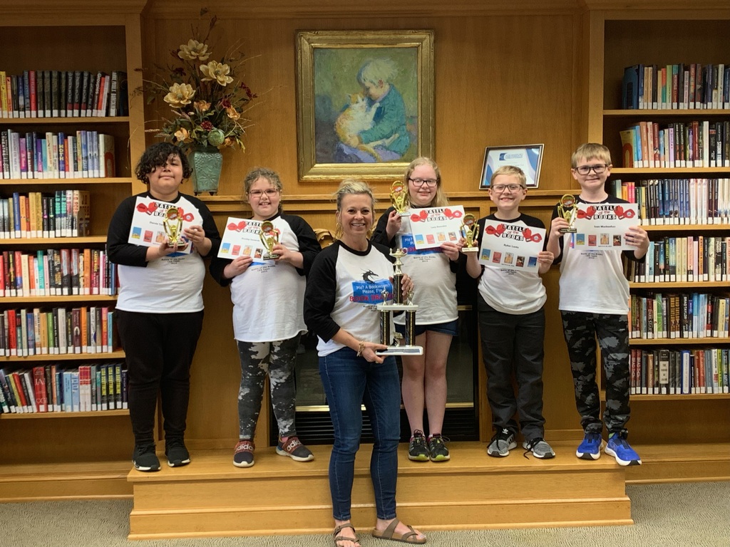 Mrs. Hickle and her 5 Battle of the Books students standing with their trophy and certificated at the Logansport Public Library